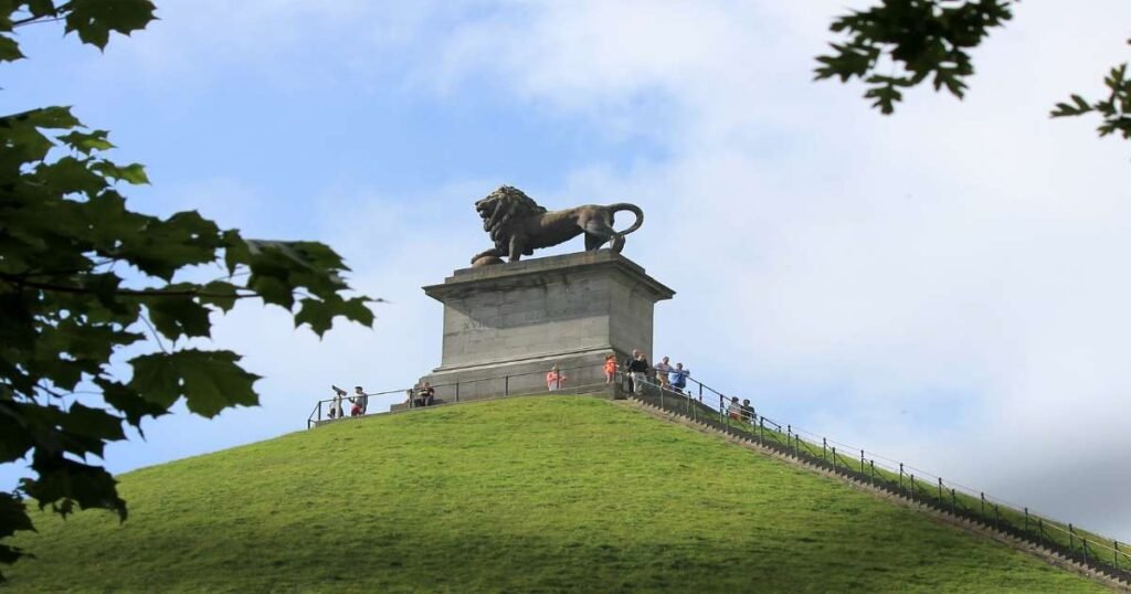 "The Lion’s Mound at the Waterloo Battlefield with its iconic lion statue overlooking the historic site."