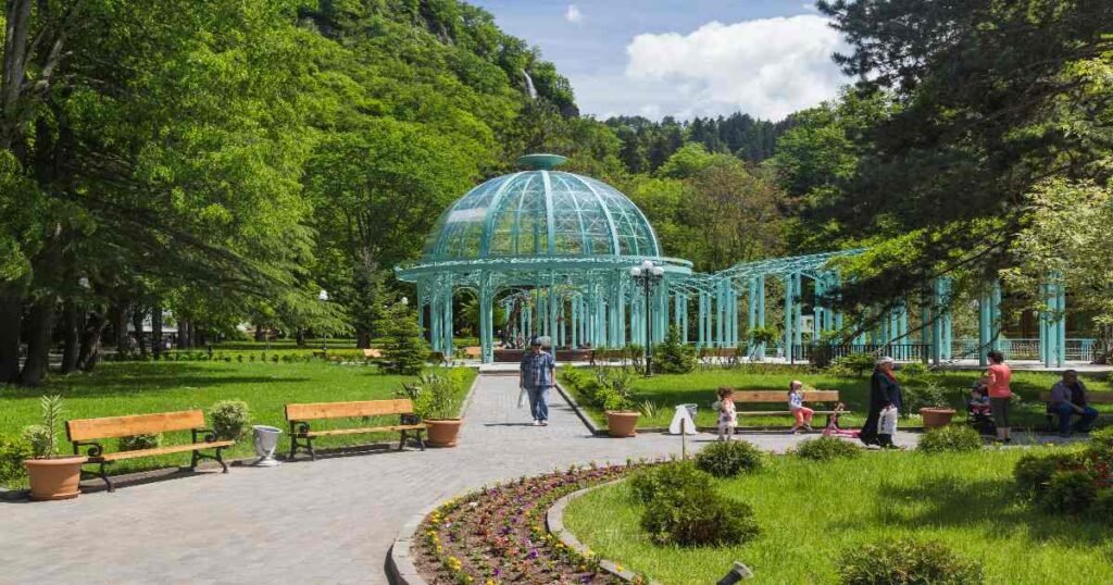 “View of Borjomi Central Park with lush forests and mountains in the background.”