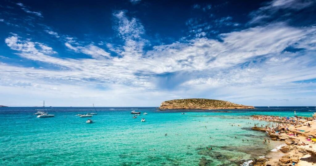 Cala Comte beach with crystal-clear waters in Ibiza.
