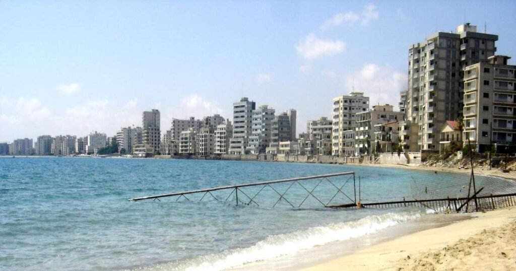 “Abandoned hotel buildings in Varosha, Famagusta, with clear blue skies.”