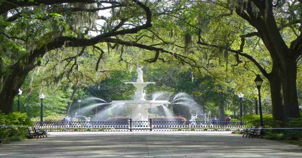 Forsyth Park fountain surrounded by oak trees draped in Spanish moss.