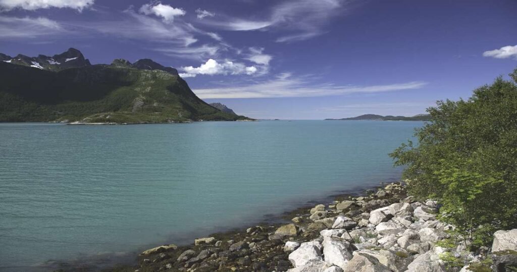 “Torghatten mountain surrounded by the Helgeland Coastline.”