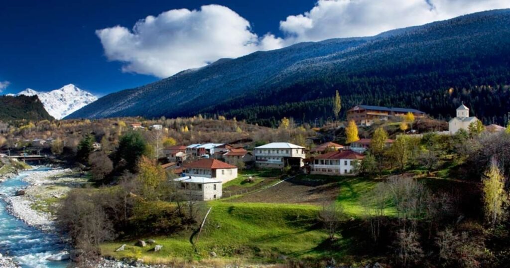 “Medieval Svan towers in Mestia with Caucasus Mountains in the background.”