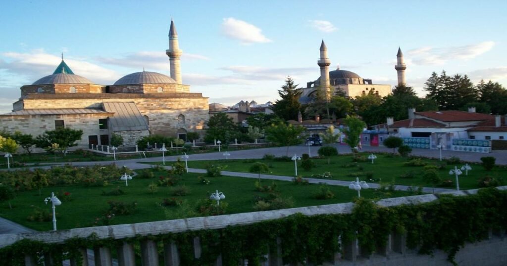 The green-domed Mevlana Museum surrounded by gardens in Konya.
