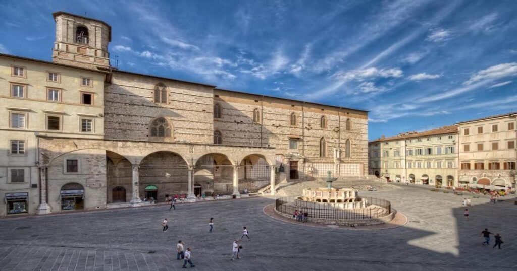 The medieval Piazza IV Novembre with its iconic fountain and historic buildings in Perugia.