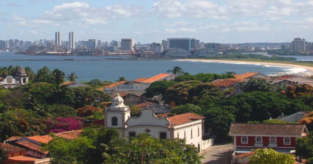 Aerial view of the colorful houses and sea coast in Olinda."