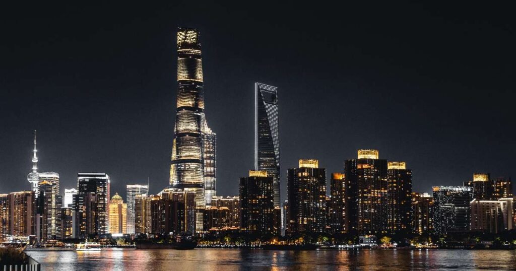 The Bund illuminated at night with views of Shanghai’s iconic skyline.