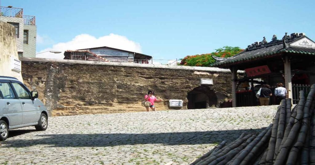 "A section of the historic Walls of Macau, showcasing its unique construction and overlooking the city."