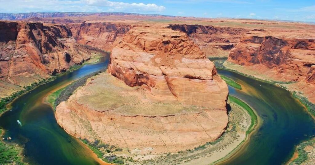 Aerial view of Horseshoe Bend with the Colorado River winding through the canyon.