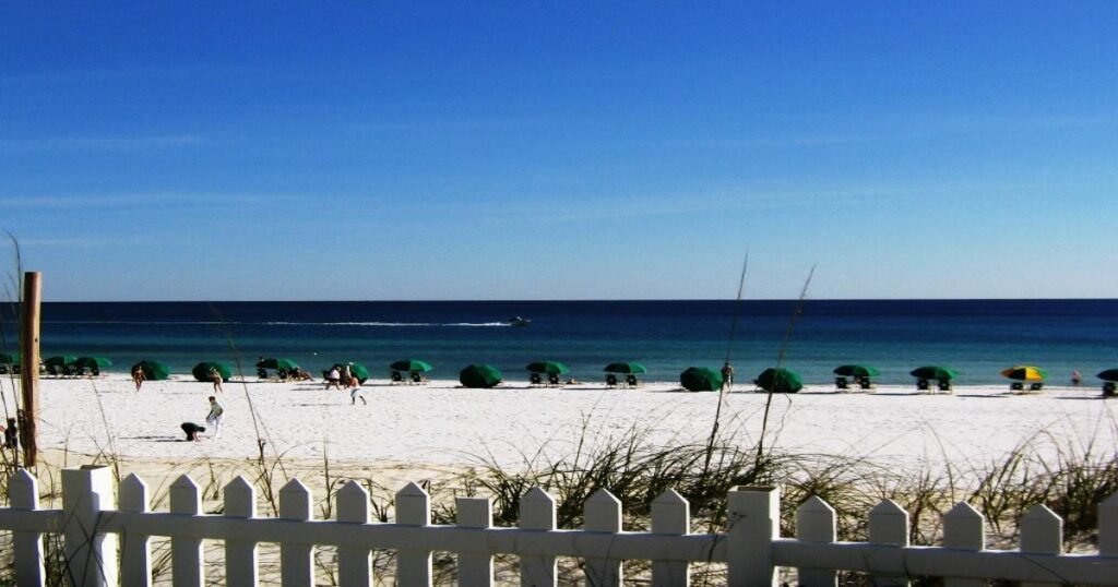 Destin’s emerald waters with boats anchored near the shoreline.