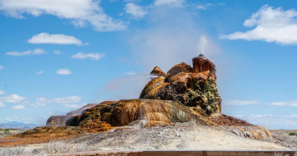 The vibrant hues of Fly Geyser against the arid desert backdrop.