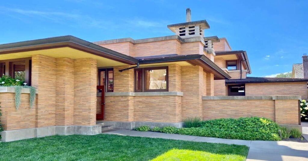 Frank Lloyd Wright’s Darwin D. Martin House surrounded by lush gardens.