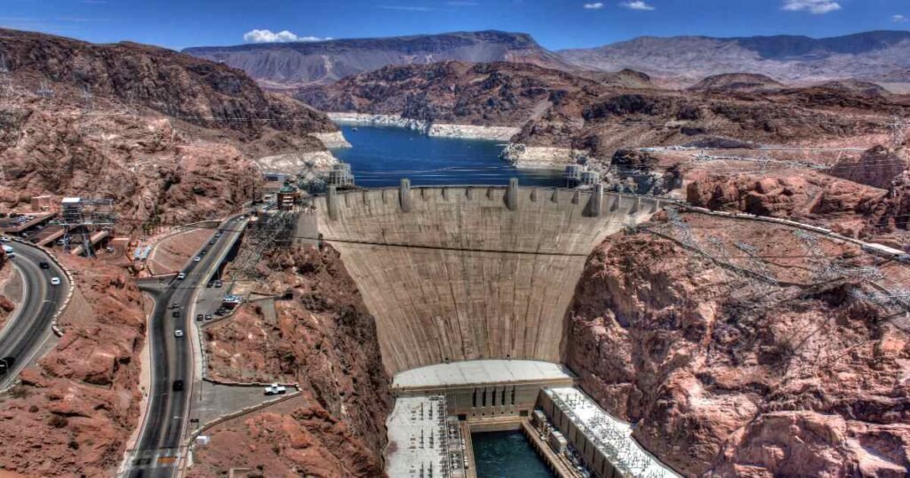 The iconic Hoover Dam spanning the Colorado River with clear blue skies.