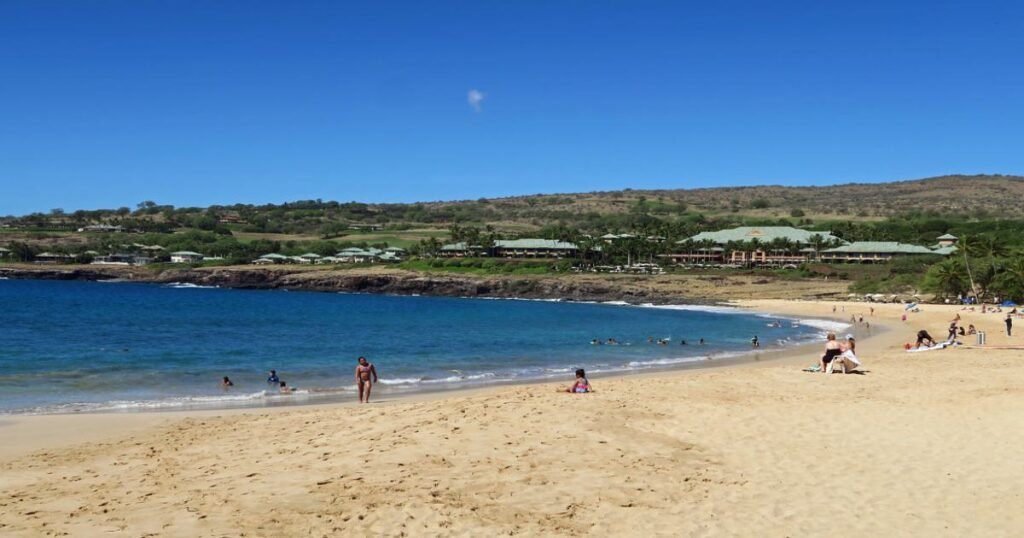 Hulopoʻe Bay with crystal-clear waters and surrounding cliffs.