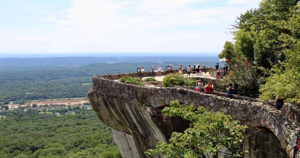 People standing at the Rock City and enjoying panoramic views of the mountain. 