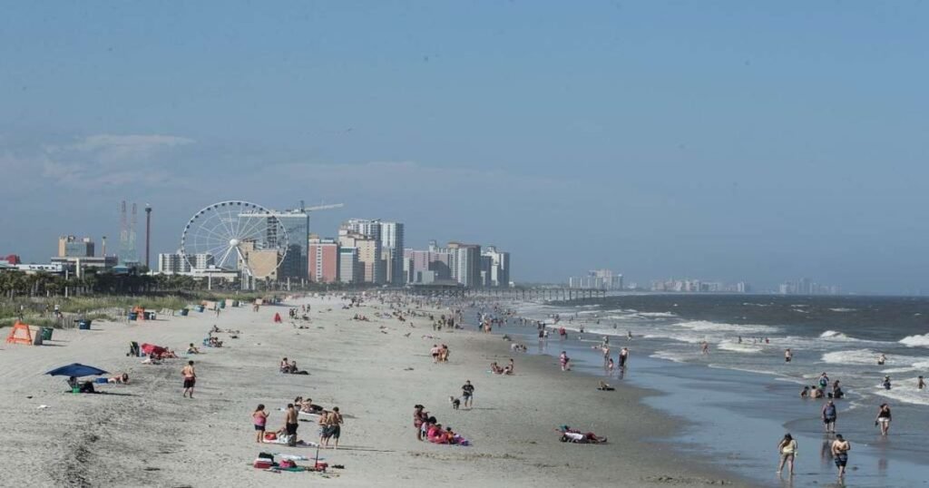An aerial view of the Myrtle Beach coastline with the SkyWheel in the background.