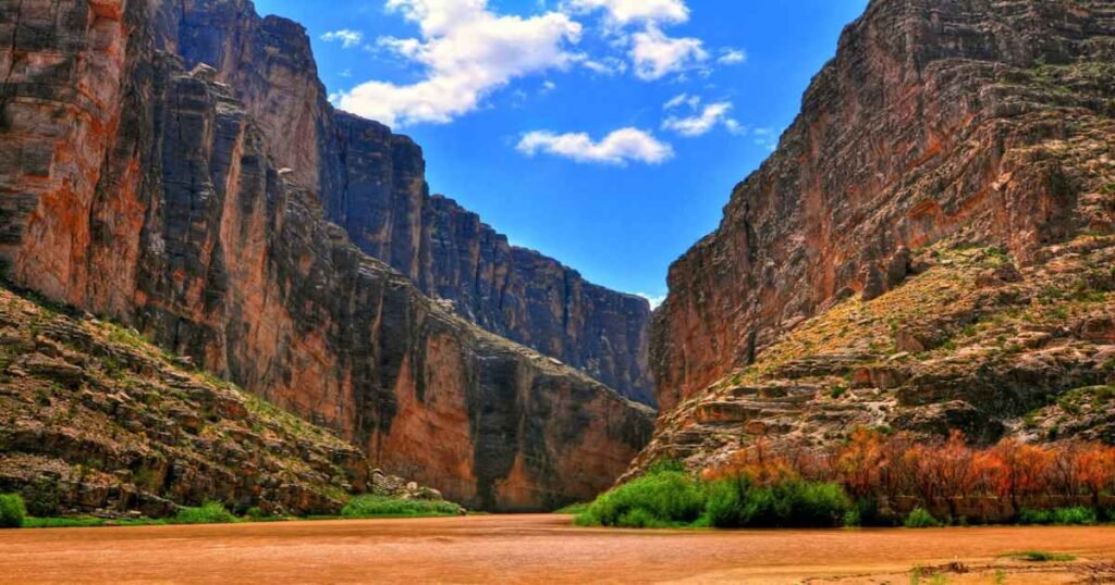 Santa Elena Canyon with towering cliffs reflected in the Rio Grande.