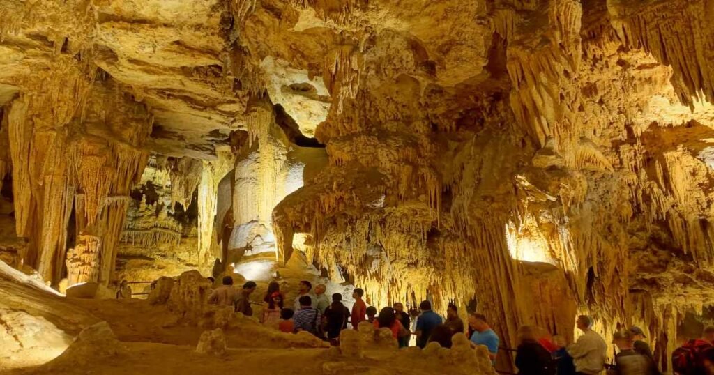 Stalactites and stalagmites illuminated inside Luray Caverns.