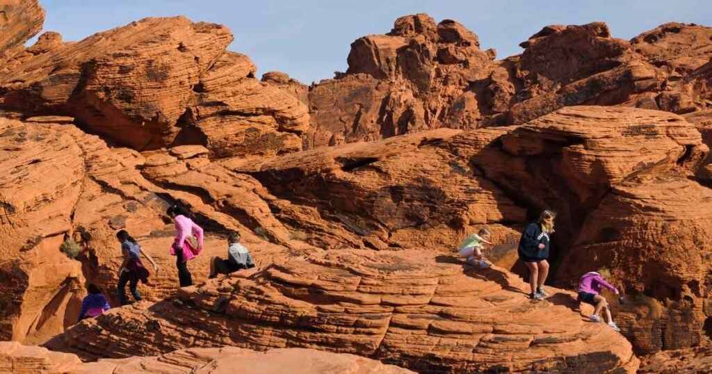 The vibrant red sandstone formations of Valley of Fire under a clear blue sky.