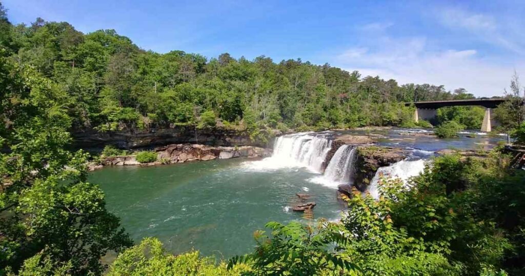 Little River Falls cascading into the canyon surrounded by lush greenery.